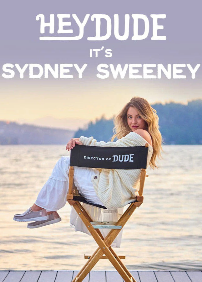 Bannière mobile Dickies x Urban Jungle – Femme portant un t-shirt Dickies blanc avec logo rouge, tenant un appareil photo vintage Yashica-635.